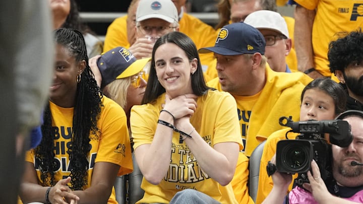 Indiana Fever star Caitlin Clark gazes adoringly at her basketball BFF, the Pacers' Tyrese Haliburton, during Game 3 of the NBA Finals.