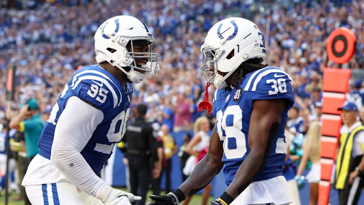 Indianapolis Colts defensive tackle Adetomiwa Adebawore (95) and defensive back Chris Lammons (38) celebrate after a play against the Arizona Cardinals during the fourth quarter of the game at Lucas Oil Stadium. Indianapolis Colts defensive tackle Adetomiwa Adebawore (95) and defensive back Chris Lammons (38) celebrate after a play against the Arizona Cardinals during the fourth quarter of the game at Lucas Oil Stadium.