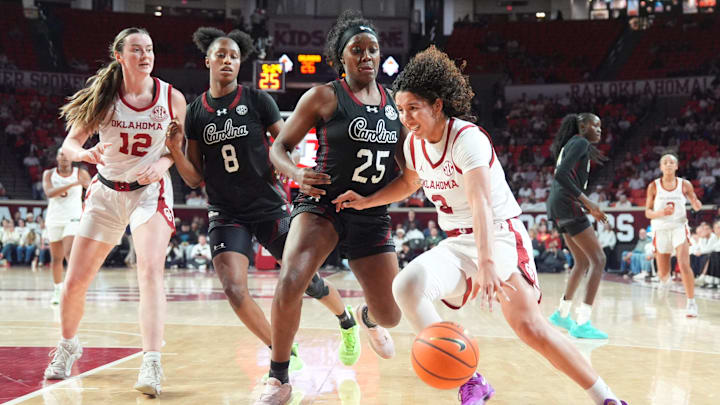 Oklahoma's Aaliyah Chavez (2) drives to the basket as South Carolina 's Raven Johnson (25) defends during the women's college basketball game between the Oklahoma Sooners and the South Carolina at the Lloyd Noble Center in Norman, Okla., Thursday Jan. 22, 2026. Oklahoma's Aaliyah Chavez (2) drives to the basket as South Carolina 's Raven Johnson (25) defends during the women's college basketball game between the Oklahoma Sooners and the South Carolina at the Lloyd Noble Center in Norman, Okla., Thursday Jan. 22, 2026.