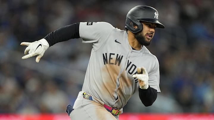 Jul 3, 2025; Toronto, Ontario, CAN; New York Yankees left fielder Jasson Dominguez (24) runs out his double against the Toronto Blue Jays during the ninth inning at Rogers Centre. Mandatory Credit: John E. Sokolowski-Imagn Images