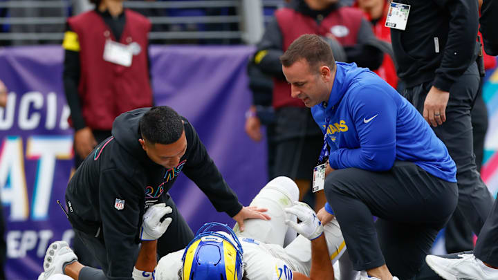 Oct 12, 2025; Baltimore, Maryland, USA; Los Angeles Rams wide receiver Puka Nacua (12) is checked on by trainers during the second quarter of the game against the Baltimore Ravens at M&T Bank Stadium. Mandatory Credit: Peter Casey-Imagn Images Oct 12, 2025; Baltimore, Maryland, USA; Los Angeles Rams wide receiver Puka Nacua (12) is checked on by trainers during the second quarter of the game against the Baltimore Ravens at M&T Bank Stadium. Mandatory Credit: Peter Casey-Imagn Images