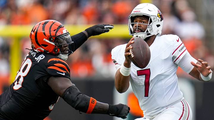 Dec 28, 2025; Cincinnati, Ohio, USA; Arizona Cardinals quarterback Jacoby Brissett (7) runs from Cincinnati Bengals defensive tackle T.J. Slaton Jr. (98) in the fourth quarter at Paycor Stadium. Mandatory Credit: Sam Greene-USA TODAY Network via Imagn Images Dec 28, 2025; Cincinnati, Ohio, USA; Arizona Cardinals quarterback Jacoby Brissett (7) runs from Cincinnati Bengals defensive tackle T.J. Slaton Jr. (98) in the fourth quarter at Paycor Stadium. Mandatory Credit: Sam Greene-USA TODAY Network via Imagn Images