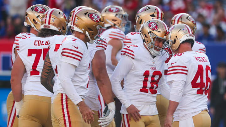 Nov 2, 2025; East Rutherford, New Jersey, USA; San Francisco 49ers place kicker Eddy Pineiro (18) reacts with long snapper Jon Weeks (46) after kicking a field goal against the New York Giants during the first half at MetLife Stadium. Mandatory Credit: Ed Mulholland-Imagn Images