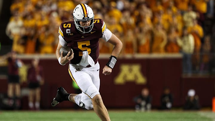 Oct 11, 2025; Minneapolis, Minnesota, USA; Minnesota Golden Gophers quarterback Drake Lindsey (5) runs the ball against the Purdue Boilermakers during the second half at Huntington Bank Stadium. Mandatory Credit: Matt Krohn-Imagn Images