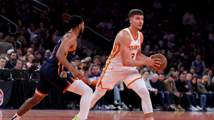 Dec 11, 2024; New York, New York, USA; Atlanta Hawks guard Bogdan Bogdanovic (13) looks to pass the ball against New York Knicks guard Cameron Payne (1) during the second quarter at Madison Square Garden. Mandatory Credit: Brad Penner-Imagn Images Dec 11, 2024; New York, New York, USA; Atlanta Hawks guard Bogdan Bogdanovic (13) looks to pass the ball against New York Knicks guard Cameron Payne (1) during the second quarter at Madison Square Garden. Mandatory Credit: Brad Penner-Imagn Images