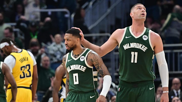 Apr 21, 2024; Milwaukee, Wisconsin, USA; Milwaukee Bucks guard Damian Lillard (0) reacts with center Brook Lopez (11) after scoring a basket in the in the second quarter against the Indiana Pacers during game one of the first round for the 2024 NBA playoffs at Fiserv Forum. Mandatory Credit: Benny Sieu-Imagn Images