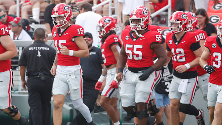 Georgia quarterback Carson Beck (15) leads the team onto the field before the start of a NCAA college football game against Auburn in Athens, Ga., on Saturday, Oct. 5, 2024.