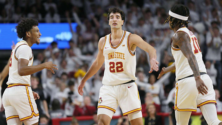 Iowa State cyclones forward Milan Momcilovic (22) celebrates with Iowa State cyclones guard Curtis Jones (5) and Iowa State cyclones guard Keshon Gilbert (10) after making a three-point shot against Marquette during the first half in the NCAA men’s basketball at Hilton Coliseum on Wednesday, Dec. 4, 2024, in Ames, Iowa. Iowa State cyclones forward Milan Momcilovic (22) celebrates with Iowa State cyclones guard Curtis Jones (5) and Iowa State cyclones guard Keshon Gilbert (10) after making a three-point shot against Marquette during the first half in the NCAA men’s basketball at Hilton Coliseum on Wednesday, Dec. 4, 2024, in Ames, Iowa.