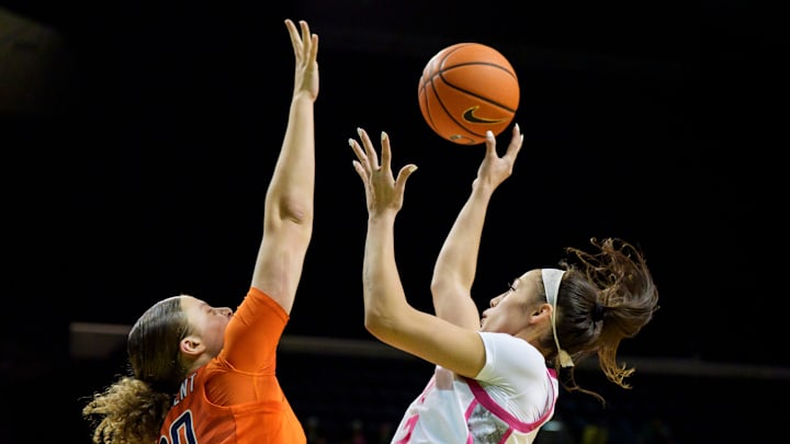 Oregon guard Katie Fiso goes up for a shot over Illinois forward Cearah Parchment as the Oregon Ducks host the Illinois Fighting Illini on Feb. 4, 2026, at Matthew Knight Arena in Eugene, Oregon.