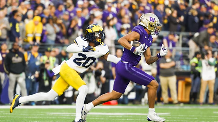 Oct 5, 2024; Seattle, Washington, USA; Michigan Wolverines defensive back Jyaire Hill (20) tackles Washington Huskies wide receiver Denzel Boston (12) following a reception by Boston during the second quarter at Alaska Airlines Field at Husky Stadium. Mandatory Credit: Joe Nicholson-Imagn Images