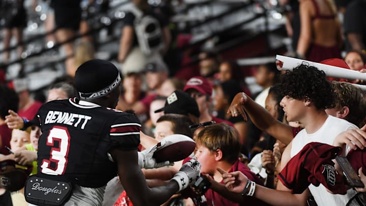 South Carolina football true freshman Mazeo Bennett signing autographs after the Garnet and Black Spring Game this April
