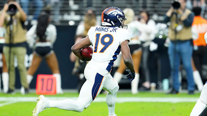 Jan 7, 2024; Paradise, Nevada, USA; Denver Broncos wide receiver Marvin Mims Jr. (19) returns a kick against the Las Vegas Raiders during the first quarter at Allegiant Stadium. Mandatory Credit: Stephen R. Sylvanie-USA TODAY Sports