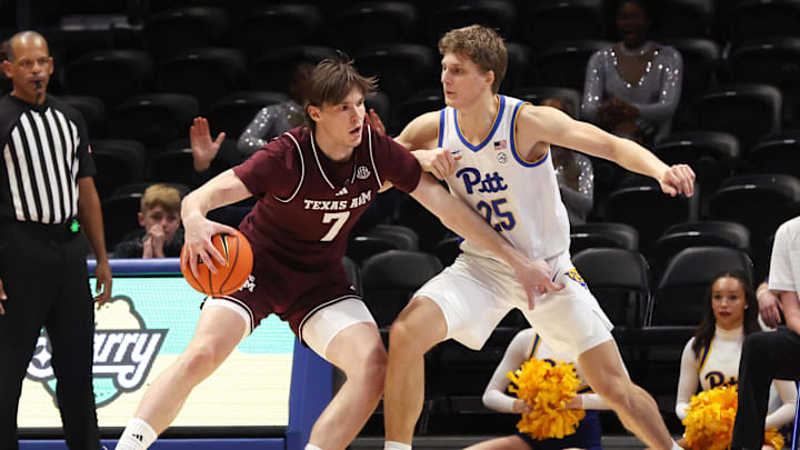 Texas A&M Aggies forward Zach Clemence (7) works the ball to the basket against Pittsburgh Panthers guard Nojus Indrusaitis (25) during the second half at the Petersen Events Center. Mandatory Credit: Charles LeClaire-Imagn Images Texas A&M Aggies forward Zach Clemence (7) works the ball to the basket against Pittsburgh Panthers guard Nojus Indrusaitis (25) during the second half at the Petersen Events Center. Mandatory Credit: Charles LeClaire-Imagn Images
