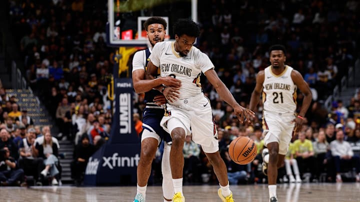Oct 29, 2025; Denver, Colorado, USA; New Orleans Pelicans forward Herb Jones (2) dribbles the ball up court under pressure from Denver Nuggets forward Cam Johnson (23) in the first quarter at Ball Arena. Mandatory Credit: Isaiah J. Downing-Imagn Images