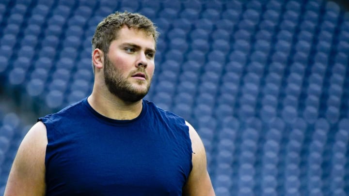 Tennessee Titans offensive tackle Peter Skoronski warms up before a game against the Houston Texans at NRG Stadium in Houston, Texas., Sunday, Dec. 31, 2023.
