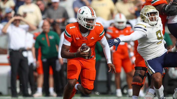 Miami Hurricanes quarterback Cam Ward scrambles against the Georgia Tech Yellow Jackets. Mandatory Credit: Brett Davis-Imagn Images