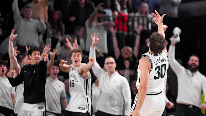 Feb 22, 2025; Nashville, Tennessee, USA;  Vanderbilt Commodores bench react after a made three point basket by Commodores guard Chris Manon (30) against the Mississippi Rebels during the second half at Memorial Gymnasium. Mandatory Credit: Steve Roberts-Imagn Images
