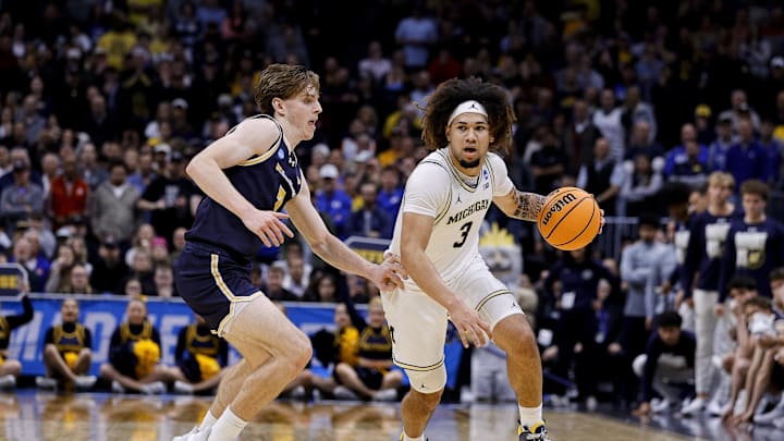 March 20, 2025; Denver, CO, USA; Michigan Wolverines guard Tre Donaldson (3) dribbles the ball during the second half as UC San Diego Tritons guard Hayden Gray (3) defends at Ball Arena. Mandatory Credit: Isaiah J. Downing-Imagn Images