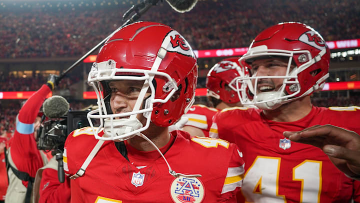 Dec 8, 2024; Kansas City, Missouri, USA; Kansas City Chiefs place kicker Matthew Wright (49) celebrates with long snapper James Winchester (41) after the win over the Los Angeles Chargers at GEHA Field at Arrowhead Stadium. Mandatory Credit: Denny Medley-Imagn Images