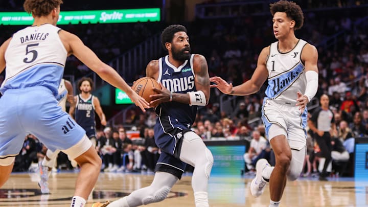 Nov 25, 2024; Atlanta, Georgia, USA; Dallas Mavericks guard Kyrie Irving (11) drives to the basket against the Atlanta Hawks in the first quarter at State Farm Arena. Mandatory Credit: Brett Davis-Imagn Images