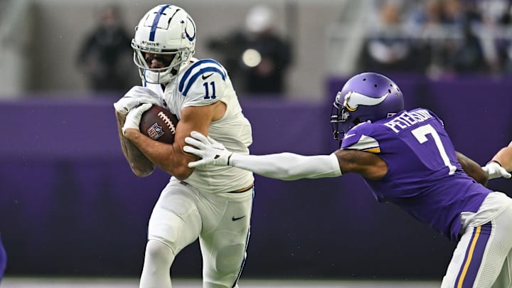 Dec 17, 2022; Minneapolis, Minnesota, USA; Indianapolis Colts wide receiver Michael Pittman Jr. (11) and Minnesota Vikings cornerback Patrick Peterson (7) in action during the game at U.S. Bank Stadium. Mandatory Credit: Jeffrey Becker-Imagn Images