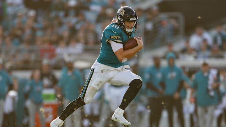 Dec 15, 2024; Jacksonville, Florida, USA; Jacksonville Jaguars quarterback Mac Jones (10) runs with the ball against the New York Jets in the fourth quarter at EverBank Stadium. Mandatory Credit: Nathan Ray Seebeck-Imagn Images