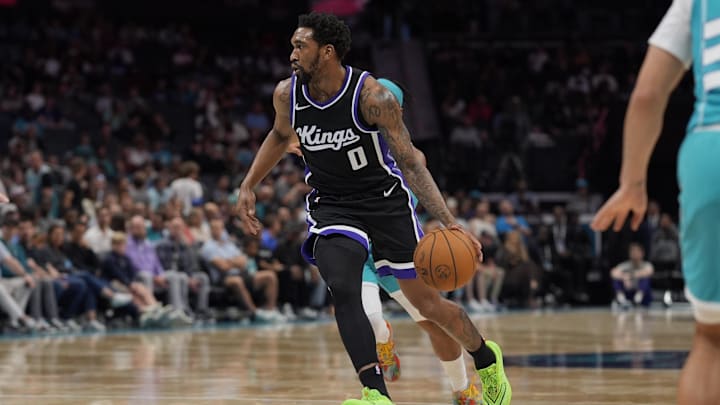 Apr 4, 2025; Charlotte, North Carolina, USA; Sacramento Kings guard Malik Monk (0) drives to the basket against the Charlotte Hornets during the second quarter at Spectrum Center. Mandatory Credit: Jim Dedmon-Imagn Images