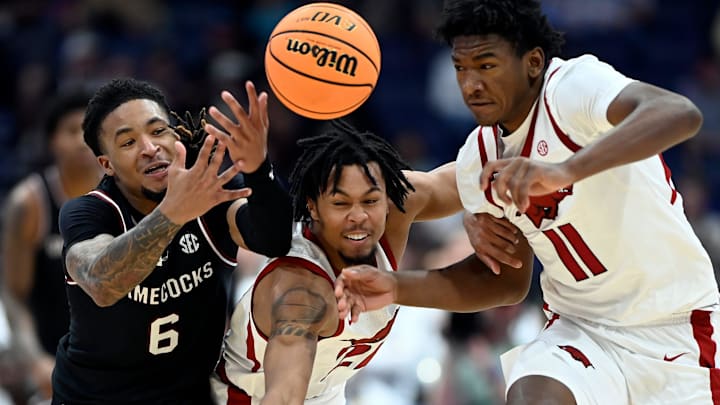 South Carolina guard Jamarii Thomas (6), Arkansas’ Billy Richmond III (24) and Karter Knox (11) chase the ball during a NCAA college basketball first round game at the men’s Southeastern Conference Tournament Wednesday, March 12, 2025, in Nashville, Tenn. Arkansas won 72-68.