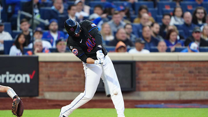 May 13, 2024; New York City, New York, USA; New York Mets designated hitter JD Martinez (28) hits an RBI double against the Philadelphia Phillies during the second inning at Citi Field. Mandatory Credit: Gregory Fisher-USA TODAY Sports