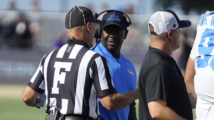 Sep 27, 2025; Evanston, Illinois, USA; UCLA Bruins interim head coach Tim Skipper talks to a official during the first half against the Northwestern Wildcats during the first half at Northwestern Medicine Field at Martin Stadium. Mandatory Credit: David Banks-Imagn Images