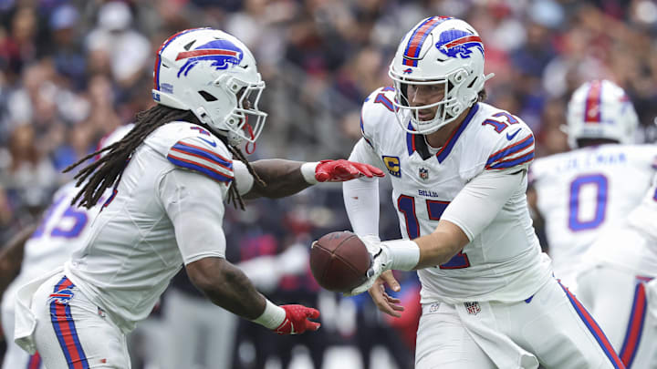 Oct 6, 2024; Houston, Texas, USA; Buffalo Bills quarterback Josh Allen (17) hands off to running back James Cook (4) 