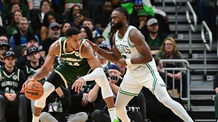 Nov 10, 2024; Milwaukee, Wisconsin, USA;  Milwaukee Bucks forward Giannis Antetokounmpo (34) is guarded by Boston Celtics forward Jaylen Brown (7) in the fourth quarter at Fiserv Forum. Mandatory Credit: Benny Sieu-Imagn Images