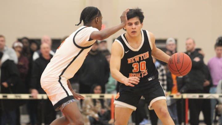 Newton North's Jose Padilla dribbles under pressure from North's Amir Jenkins during an MIAA Division I Final Four game.

Jose Padilla Amir Jenkins