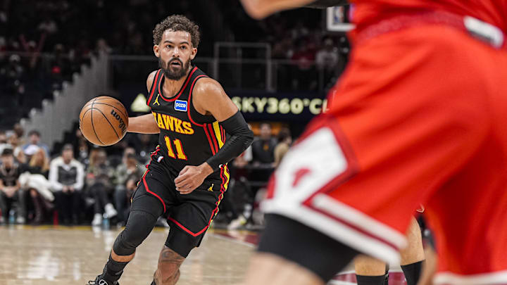 Dec 21, 2025; Atlanta, Georgia, USA; Atlanta Hawks guard Trae Young (11) dribbles against the Chicago Bulls during the first half at State Farm Arena. Mandatory Credit: Dale Zanine-Imagn Images