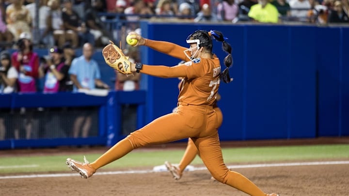 Jun 5, 2025; Oklahoma City, OK, USA;  Texas Longhorns pitcher Citlaly Gutierrez (77) throws a pitch in the sixth inning against the Texas Tech Red Raiders during game two of the NCAA Softball Women's College World Series finals at Devon Park. Mandatory Credit: Brett Rojo-Imagn Images