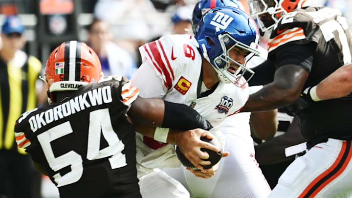 Sep 22, 2024; Cleveland, Ohio, USA; Cleveland Browns defensive end Ogbo Okoronkwo (54) sacks New York Giants quarterback Daniel Jones (8) during the second half at Huntington Bank Field. Mandatory Credit: Ken Blaze-Imagn Images