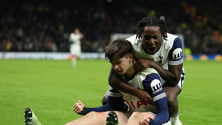 Mikey Moore and Damola Ajayi - two of Spurs' goalscorers - celebrate a goal