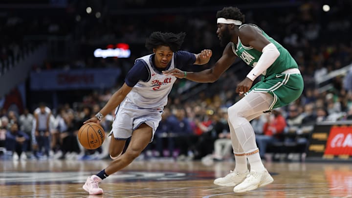 Dec 15, 2024; Washington, District of Columbia, USA; Washington Wizards guard Bub Carrington (8) drives to the basket as Boston Celtics center Neemias Queta (88) defends in the fourth quarter at Capital One Arena. Mandatory Credit: Geoff Burke-Imagn Images