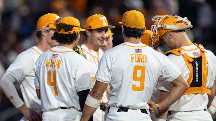 Tennessee's Tegan Kuhns (21) smiles as Josh Elander gives him encouragement in the 7th inning of the NCAA college baseball game against Texas in Knoxville, Tennessee on May 8, 2026.