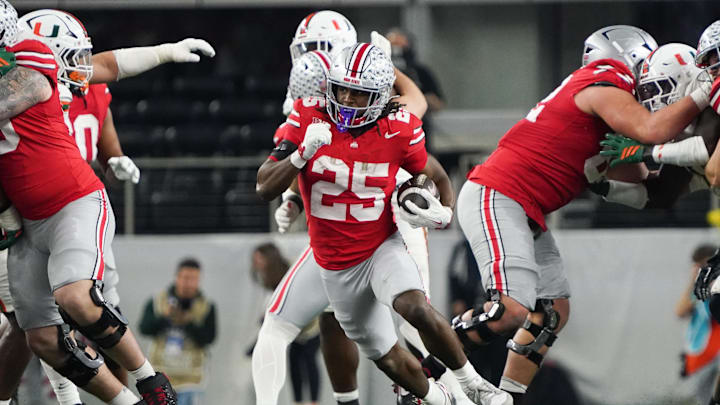 Dec 31, 2025; Arlington, TX, USA; Ohio State Buckeyes running back Bo Jackson (25) runs the ball in the third quarter against the Miami Hurricanes during the 2025 Cotton Bowl and quarterfinal game of the College Football Playoff at AT&T Stadium. Mandatory Credit: Raymond Carlin III-Imagn Images