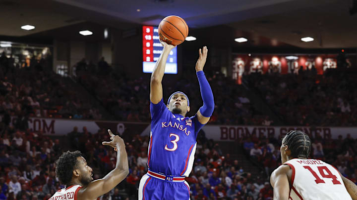 Feb 17, 2024; Norman, Oklahoma, USA; Kansas Jayhawks guard Dajuan Harris Jr. (3) shoots between