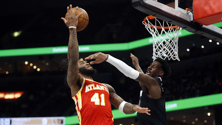Mar 8, 2024; Memphis, Tennessee, USA; Atlanta Hawks forward Saddiq Bey (41) shoots as Memphis Grizzlies forward-center Jaren Jackson Jr. (13) defends during the first half at FedExForum. Mandatory Credit: Petre Thomas-USA TODAY Sports