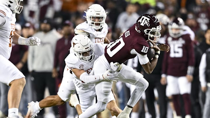 Nov 30, 2024; College Station, Texas, USA; Texas A&M Aggies quarterback Marcel Reed (10) is tackled by Texas Longhorns defensive back Michael Taaffe (16) during the first quarter. The Longhorns defeated the Aggies 17-7 at Kyle Field. Mandatory Credit: Maria Lysaker-Imagn Images Nov 30, 2024; College Station, Texas, USA; Texas A&M Aggies quarterback Marcel Reed (10) is tackled by Texas Longhorns defensive back Michael Taaffe (16) during the first quarter. The Longhorns defeated the Aggies 17-7 at Kyle Field. Mandatory Credit: Maria Lysaker-Imagn Images