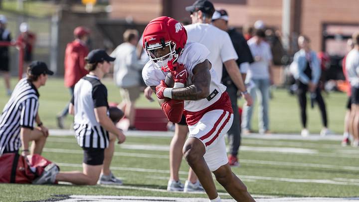 Arkansas Razorbacks wide receiver Chris Marshall (6) wraps up the ball during a passing drill during spring practice at the Arkansas Razorbacks practice facilities. Arkansas Razorbacks wide receiver Chris Marshall (6) wraps up the ball during a passing drill during spring practice at the Arkansas Razorbacks practice facilities.