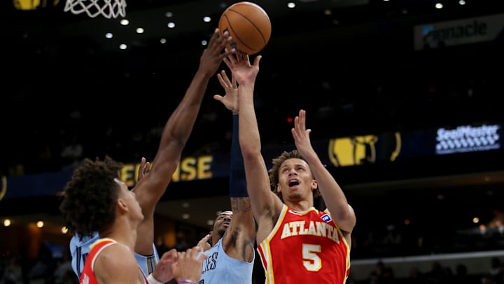 Jan 21, 2026; Memphis, Tennessee, USA; Atlanta Hawks guard Dyson Daniels (5) shoots as Memphis Grizzlies forward/center Jaren Jackson Jr. (8) and guard Ja Morant (12) defends during the second quarter at FedExForum. Mandatory Credit: Petre Thomas-Imagn Images Jan 21, 2026; Memphis, Tennessee, USA; Atlanta Hawks guard Dyson Daniels (5) shoots as Memphis Grizzlies forward/center Jaren Jackson Jr. (8) and guard Ja Morant (12) defends during the second quarter at FedExForum. Mandatory Credit: Petre Thomas-Imagn Images