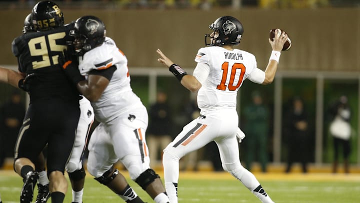Nov 22, 2014; Waco, TX, USA; Oklahoma State Cowboys quarterback Mason Rudolph (10) throws a pass in the first quarter against the Baylor Bears at McLane Stadium. Mandatory Credit: Tim Heitman-Imagn Images Nov 22, 2014; Waco, TX, USA; Oklahoma State Cowboys quarterback Mason Rudolph (10) throws a pass in the first quarter against the Baylor Bears at McLane Stadium. Mandatory Credit: Tim Heitman-Imagn Images
