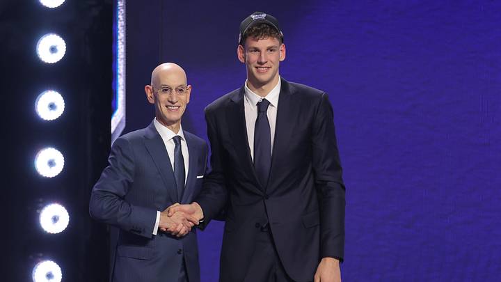 NBA commissioner Adam Silver and Hannes Steinbach stand for the cameras after the Husky got drafted. 