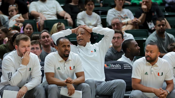 Jan 18, 2025; Coral Gables, Florida, USA; Miami Hurricanes interim head coach Bill Courtney reacts from the bench against the Southern Methodist Mustangs during the first half at Watsco Center. Mandatory Credit: Sam Navarro-Imagn Images