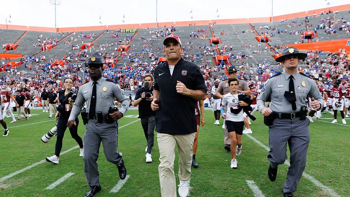 Oct 10, 2026; Gainesville, Florida, USA; South Carolina Gamecocks head coach Shane Beamer runs to meet the Florida head coach after a game against the Florida Gators at Ben Hill Griffin Stadium. Mandatory Credit: Matt Pendleton-Imagn Images Oct 10, 2026; Gainesville, Florida, USA; South Carolina Gamecocks head coach Shane Beamer runs to meet the Florida head coach after a game against the Florida Gators at Ben Hill Griffin Stadium. Mandatory Credit: Matt Pendleton-Imagn Images
