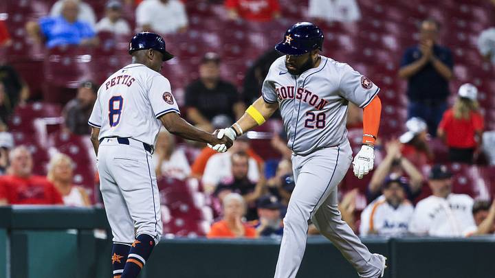 Sep 4, 2024; Cincinnati, Ohio, USA; Houston Astros first baseman Jon Singleton (28) shakes hands with third base coach Gary Pettis (8) after hitting a solo home run in the seventh inning against the Cincinnati Reds at Great American Ball Park. Mandatory Credit: Katie Stratman-Imagn Images